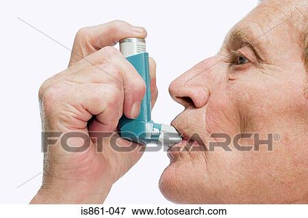 Man using inhaler View Large Photo Image Stock Photo - Man using inhaler. Fotosearch
