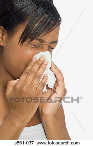Stock Photo - Woman blowing nose. Fotosearch