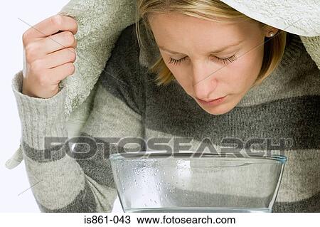 Woman inhaling from a bowl View Large Photo Image Stock Image - Woman inhaling from a bowl. Fotosearch