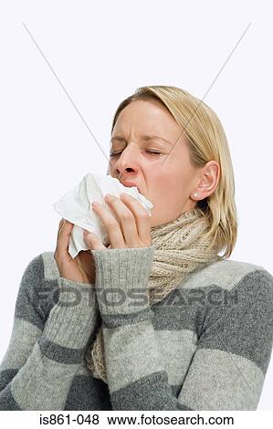 Stock Photo - Woman sneezing. Fotosearch