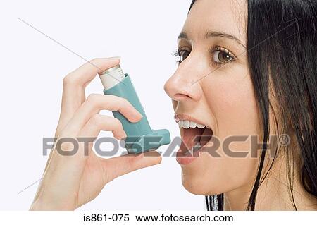 Woman using inhaler View Large Photo Image Stock Photography - Woman using inhaler. Fotosearch