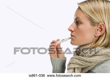 Woman using thermometer View Large Photo Image Stock Photograph - Woman using thermometer. Fotosearch