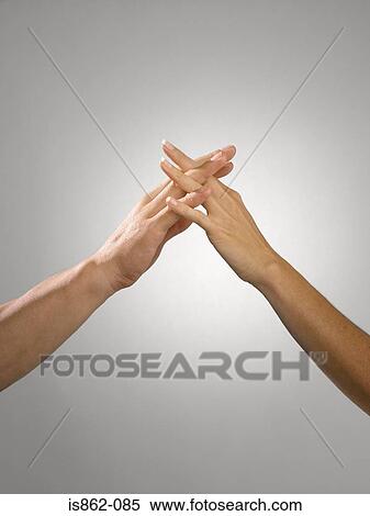 Man and woman with fingers entwined View Large Photo Image Stock Photography - Man and woman with fingers entwined. Fotosearch