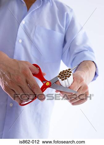 Man cutting cigarettes View Large Photo Image Stock Image - Man cutting cigarettes. Fotosearch