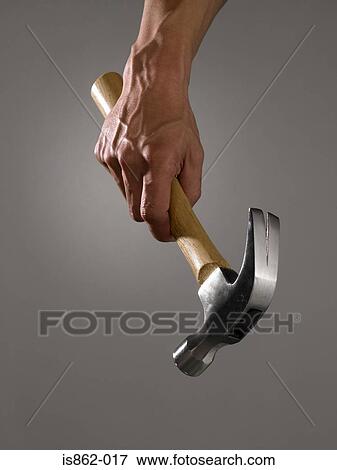 Man holding hammer View Large Photo Image Stock Photo - Man holding hammer. Fotosearch