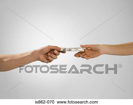 Man passing banknote to woman View Large Photo Image Stock Image - Man passing banknote to woman. Fotosearch