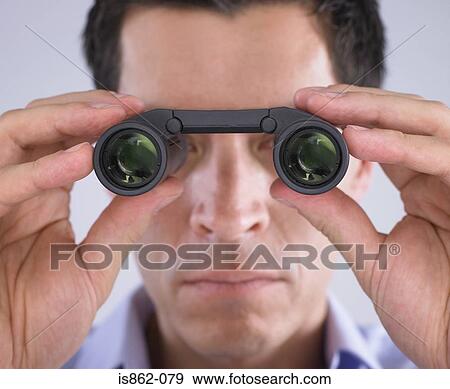 Stock Photo - Man using binoculars. Fotosearch