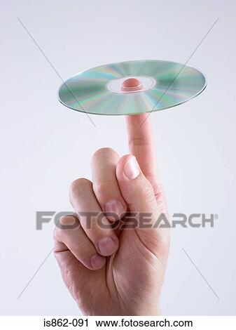 Man with compact disc on finger View Large Photo Image Stock Image - Man with compact disc on finger. Fotosearch