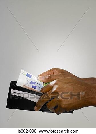 Stock Image - Man with wallet. Fotosearch