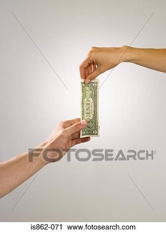 People holding banknote View Large Photo Image Stock Image - People holding banknote. Fotosearch