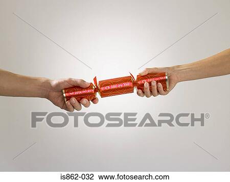 People pulling cracker View Large Photo Image Stock Image - People pulling cracker. Fotosearch
