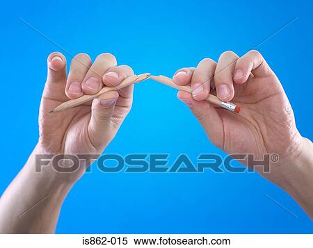 Stock Photography - Person breaking pencil. Fotosearch