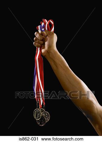 Person holding medals View Large Photo Image Stock Image - Person holding medals. Fotosearch