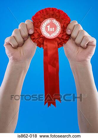 Person holding rosette View Large Photo Image Stock Photo - Person holding rosette. Fotosearch