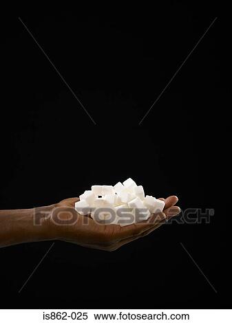 Person holding sugar lumps View Large Photo Image Stock Photography - Person holding sugar lumps. Fotosearch