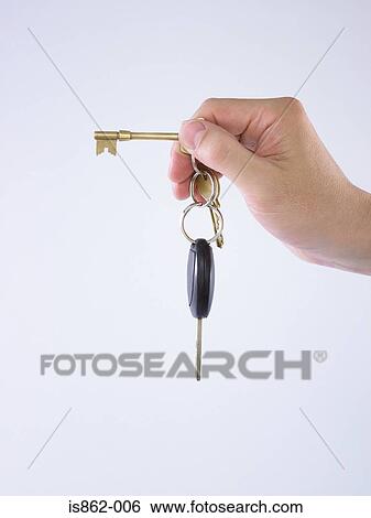 Stock Photograph - Person with keys. Fotosearch