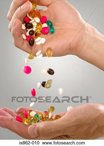Person with pills and capsules View Large Photo Image Stock Image - Person with pills and capsules. Fotosearch