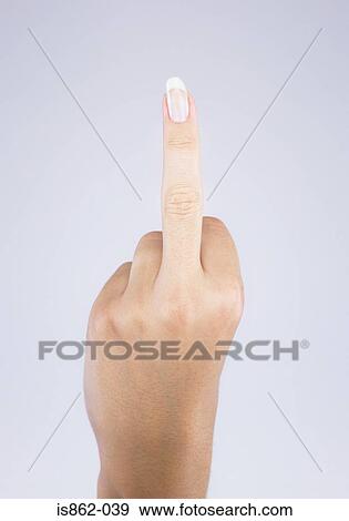 Stock Photo - Woman giving obscene hand gesture. Fotosearch