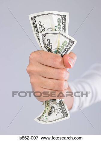 Woman holding banknotes View Large Photo Image Stock Photo - Woman holding banknotes. Fotosearch