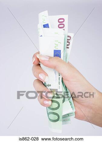Woman holding banknotes View Large Photo Image Stock Photo - Woman holding banknotes. Fotosearch