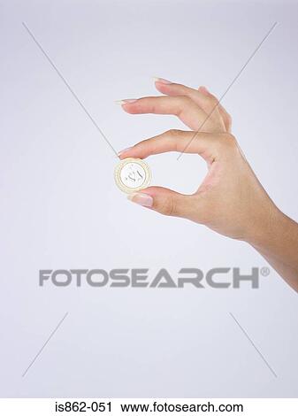Woman holding coin View Large Photo Image Stock Image - Woman holding coin. Fotosearch