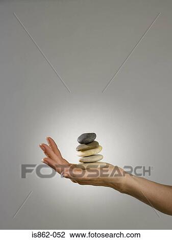 Woman holding pile of stones View Large Photo Image Stock Image - Woman holding pile of stones. Fotosearch