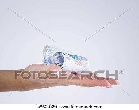 Woman holding roll of banknotes View Large Photo Image Stock Photo - Woman holding roll of banknotes. Fotosearch