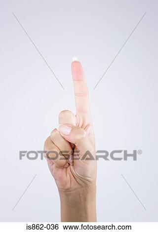 Stock Photograph - Woman pointing upwards. Fotosearch