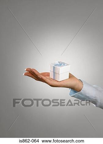Woman with a gift View Large Photo Image Picture - Woman with a gift. Fotosearch