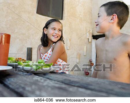 Stock Photograph - Children at picnic table. Fotosearch