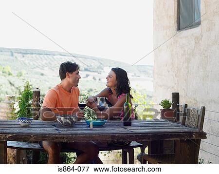 Couple having wine View Large Photo Image Stock Photo - Couple having wine. Fotosearch