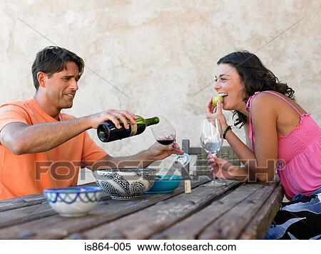Couple having wine View Large Photo Image Stock Photography - Couple having wine. Fotosearch
