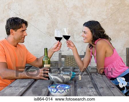 Picture - Couple toasting with wine. Fotosearch
