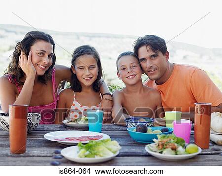 Family having outdoor meal View Large Photo Image Picture - Family having outdoor meal. Fotosearch