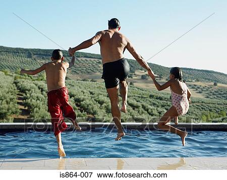 Stock Photo - Father and children jumping into pool. Fotosearch