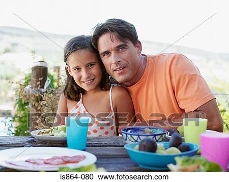 Father and daughter at meal View Large Photo Image Stock Image - Father and daughter at meal. Fotosearch
