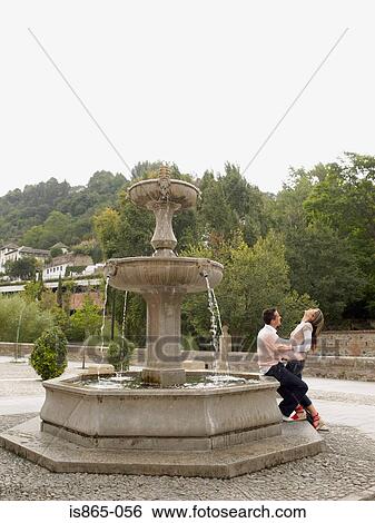 Couple by fountain View Large Photo Image Stock Photograph - Couple by fountain. Fotosearch