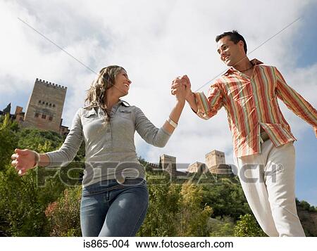 Couple holding hands View Large Photo Image Picture - Couple holding hands. Fotosearch