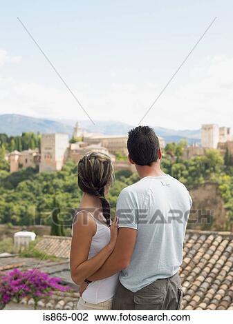 Couple looking at alhambra palace View Large Photo Image Stock Image - Couple looking at alhambra palace. Fotosearch