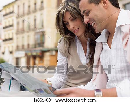 Stock Image - Couple looking at map. Fotosearch