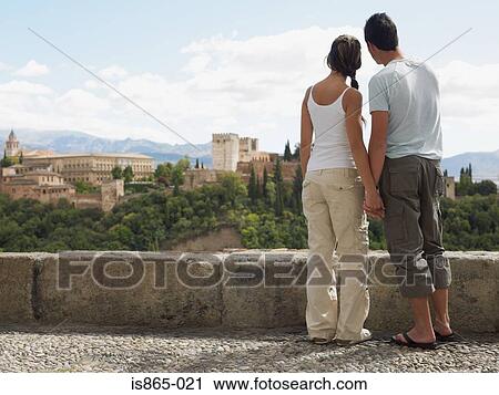 Couple looking towards alhambra View Large Photo Image Stock Image - Couple looking towards alhambra. Fotosearch