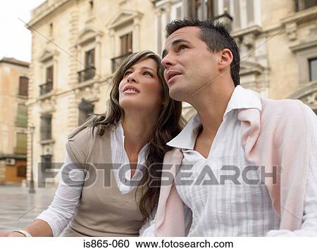 Stock Image - Couple looking up. Fotosearch