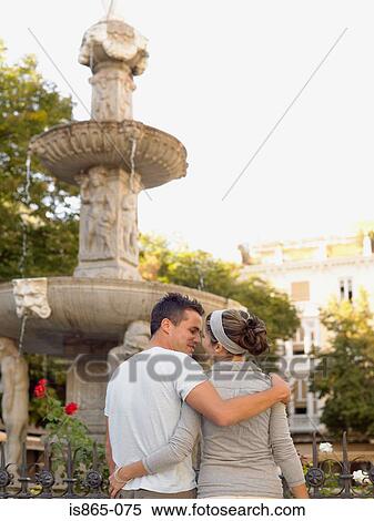 Stock Photography - Couple near fountain. Fotosearch
