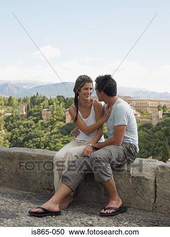 Stock Image - Couple on wall near alhambra. Fotosearch