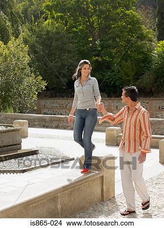 Couple walking View Large Photo Image Picture - Couple walking. Fotosearch