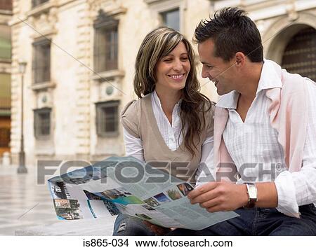Couple with a map View Large Photo Image Picture - Couple with a map. Fotosearch