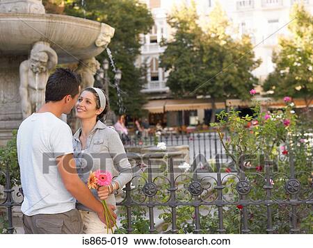Stock Photo - Romantic couple in town square. Fotosearch