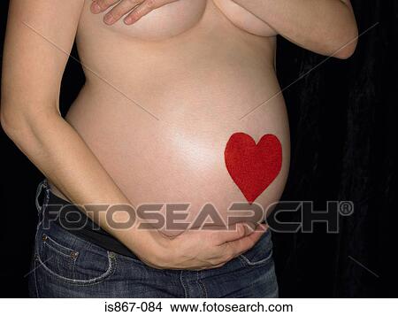 Heart on pregnant womans heart View Large Photo Image Picture - Heart on pregnant womans heart. Fotosearch