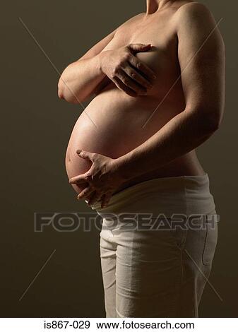 Pregnanct womans body View Large Photo Image Stock Photo - Pregnanct womans body. Fotosearch