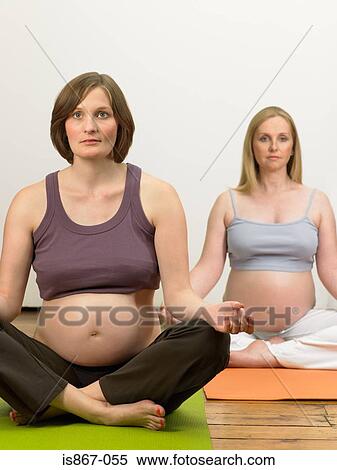 Pregnant women practising yoga View Large Photo Image Stock Photography - Pregnant women practising yoga. Fotosearch
